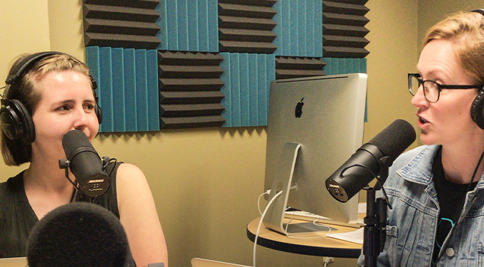 Liz and Steph talking in the Podcast room