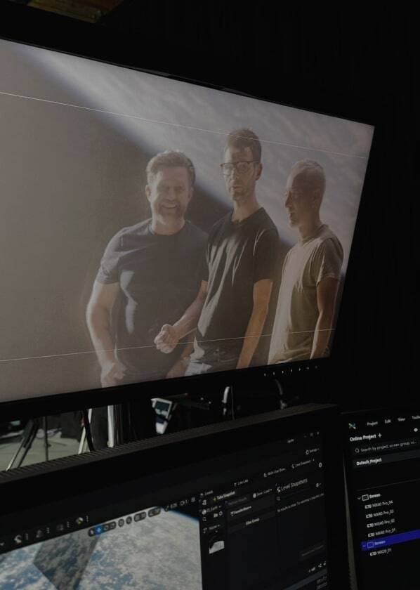 Three men on computer screen